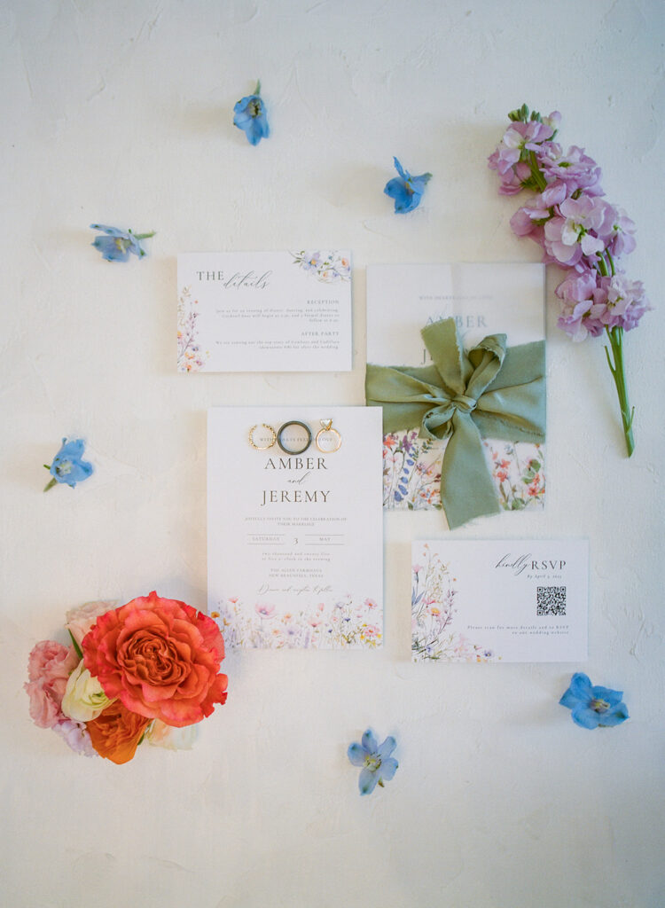 Colorful wedding invitation suite flat lay with florals captured on 120 film at The Allen Farmhaus