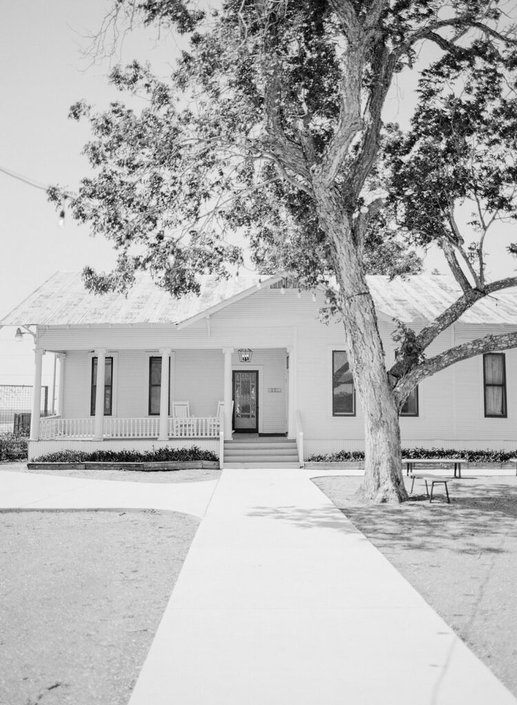Exterior of white farmhouse at The Allen Farmhaus, captured on black and white 120 film